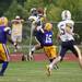 Saline senior running back Gage Hammond jumps to compete for a pass against Ypsilanti defender Tyree Weatherspoon on Friday. The Saline Hornets defeated Ypsilanti 49-14. Daniel Brenner I AnnArbor.com